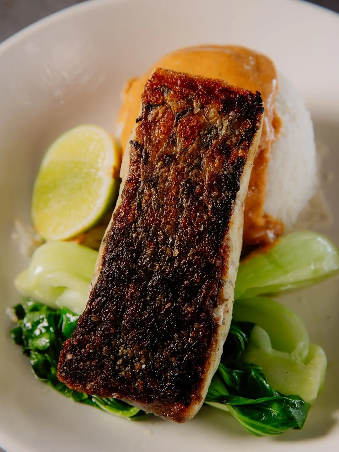 Crispy-skin barramundi with mash and bok choy at Waterbar & Grill Steakhouse, Cairns